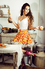 Image showing crazy real woman housewife on kitchen, eating perfoming, bizare 