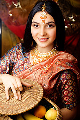 Image showing beauty sweet real indian girl in sari smiling on black background