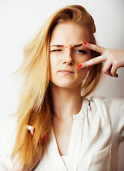 Image showing young blond woman on white backgroung gesture thumbs up, isolate