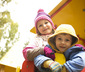 Image showing little cute boy and girl playing outside, adorable friendship