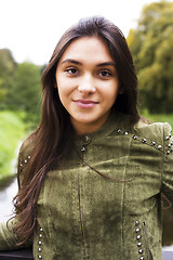 Image showing Enjoying the nature. Young woman enjoying the fresh air in green