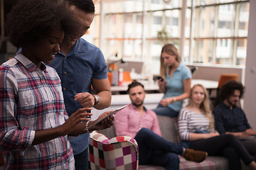 Image showing Multiethnic startup business team on meeting two in front of the