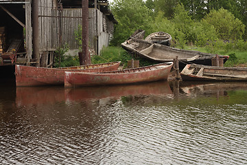 Image showing Old fish boats at the shore