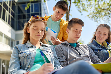 Image showing group of students with notebooks at school yard