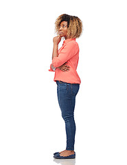 Image showing thinking african american young woman over white