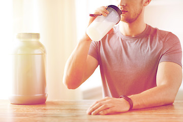Image showing close up of man drinking protein shake