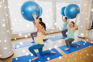 Image showing happy pregnant women with exercise balls in gym