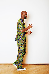 Image showing portrait of young handsome african man wearing bright green nati