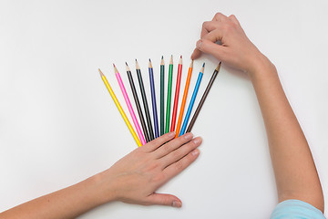 Image showing She chooses the correct pencil, close-up top