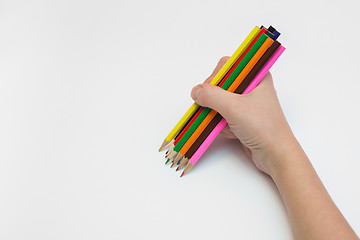 Image showing Women\'s right hand draws a dozen pencils