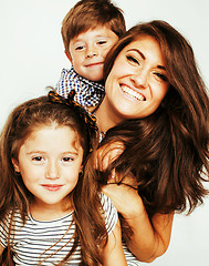 Image showing two pretty children kissing their mother happy smiling close up,