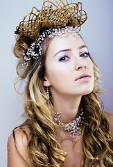 Image showing beauty young snow queen with hair crown on her head, complicate 