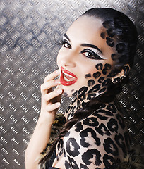 Image showing young sexy woman with leopard make up all over body, cat bodyart