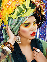 Image showing beauty bright woman with creative make up, many shawls on head l