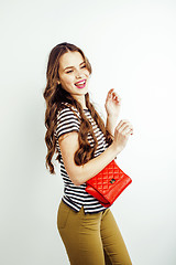 Image showing young pretty long hair woman happy smiling isolated on white background, wearing cute tiny handbag, lifestyle people concept