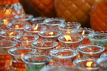 Image showing Lighting a lamp for peace in Kek Lok Si temple, Penang