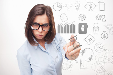 Image showing Business woman thinking many ideas.