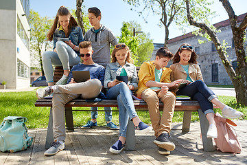 Image showing group of students with tablet pc at school yard