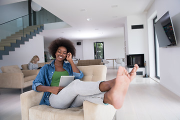 Image showing african american woman at home with digital tablet