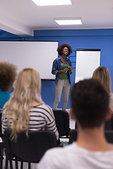 Image showing Black woman Speaker Seminar Corporate Business Meeting Concept