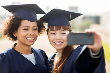 Image showing students or bachelors taking selfie by smartphone