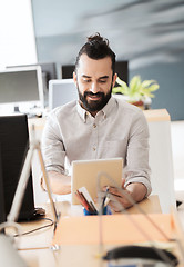 Image showing happy creative male office worker with tablet pc