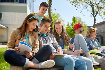 Image showing group of students with notebooks at school yard