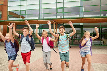 Image showing group of happy elementary school students running