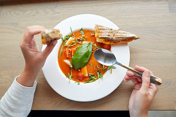 Image showing woman eating gazpacho soup at restaurant