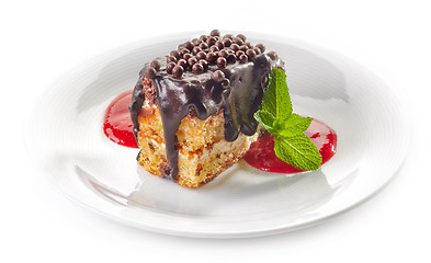 Image showing biscuit cake with chocolate and strawberry sauce