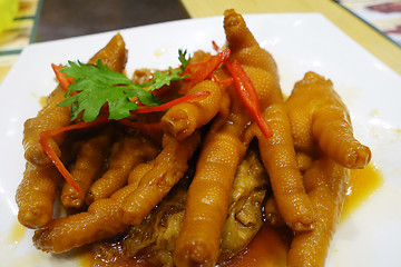 Image showing Cooked chicken feet in a white plate