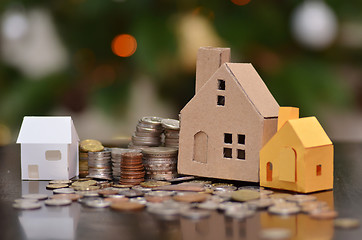 Image showing Paper house and stacks of coins standing