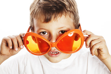 Image showing little cute boy in orange sunglasses pointing isolated close up 