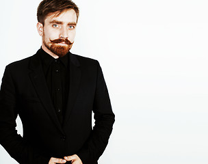 Image showing young red hair man with beard and mustache in black suit on whit