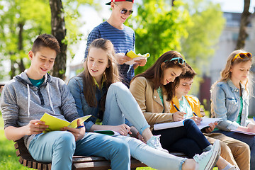 Image showing group of students with notebooks at school yard