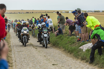 Image showing The Peloton on a Cobblestone Road - Tour de France 2015