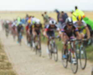 Image showing The Peloton on a Cobblestone Road - Tour de France 2015