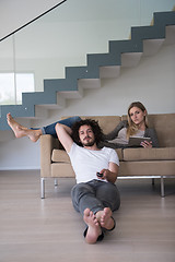 Image showing young couple relaxes in the living room