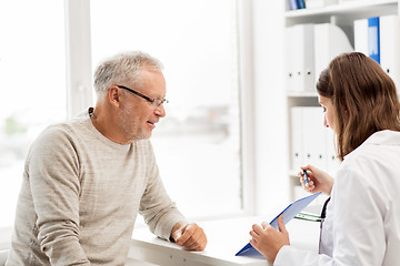 Image showing senior man and doctor meeting at hospital