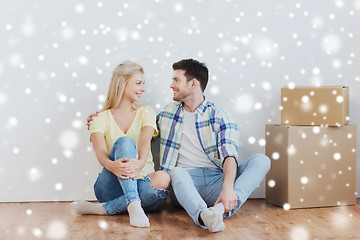 Image showing couple with cardboard boxes moving to new home