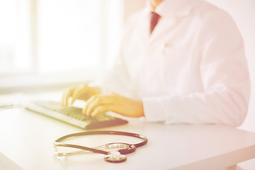 Image showing male doctor typing on the keyboard