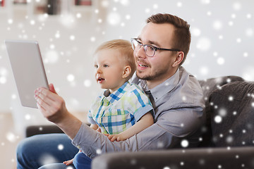 Image showing father and son with tablet pc playing at home