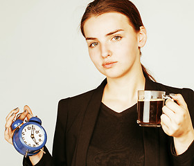 Image showing young beauty woman in business style costume waking up for work 