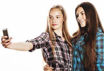 Image showing cute teenage girls making selfie isolated