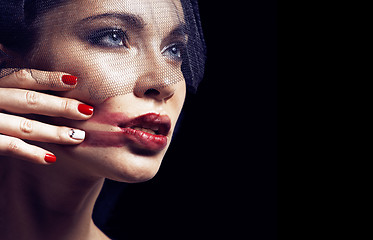 Image showing beauty brunette woman under black veil with red manicure close u