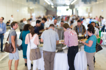 Image showing Abstract blurred people socializing during lunch break at business conference.