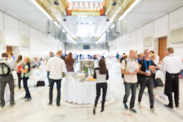 Image showing Abstract blurred people socializing during lunch break at business conference.