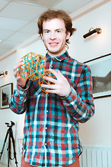 Image showing Young Man With Volumetric Models Of Geometric Solids