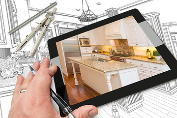 Image showing Hand on Computer Tablet Showing Photo of Kitchen Drawing Behind 