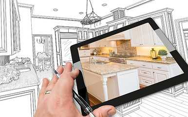 Image showing Hand on Computer Tablet Showing Photo of Kitchen Drawing Behind.